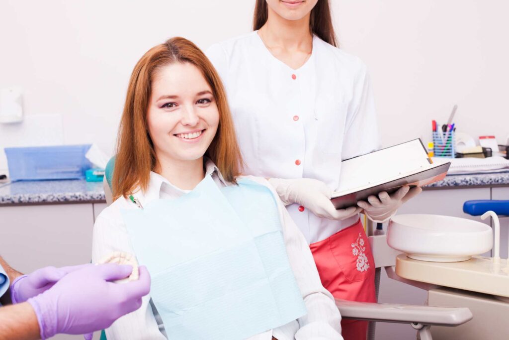 03 Young woman at the dentist during dental veneer treatment