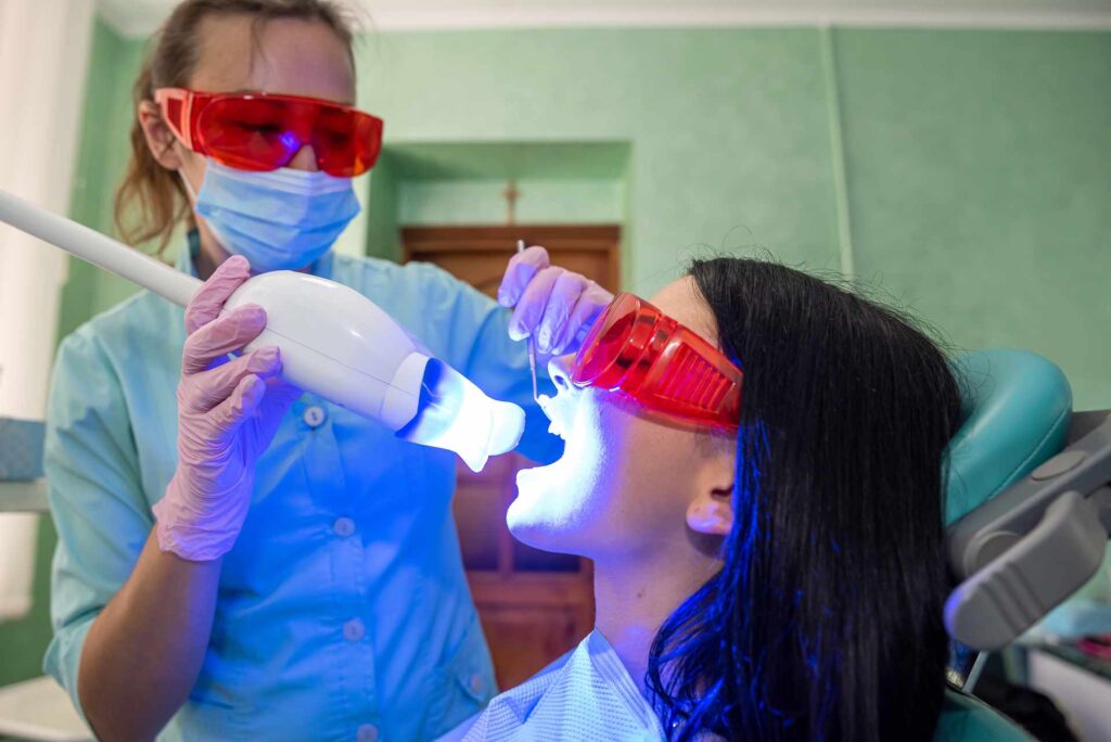 04 Teeth whitening treatment with LED in a dental clinic