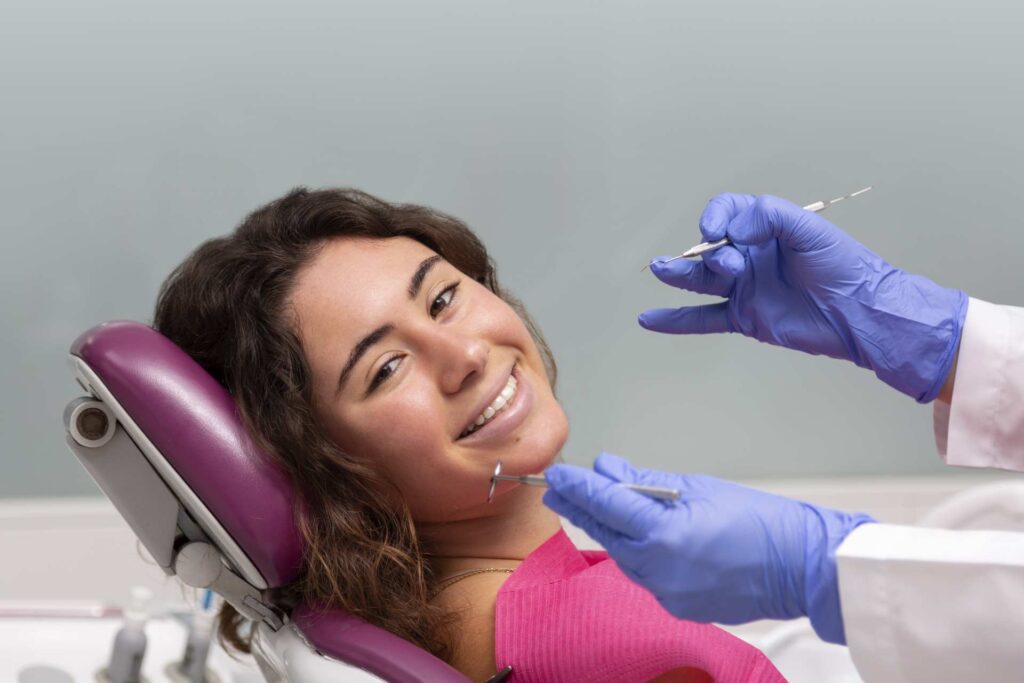 08 Portrait of a girl smiling during a treatment in a dental clinic_Lumineers vs. porcelain veneers