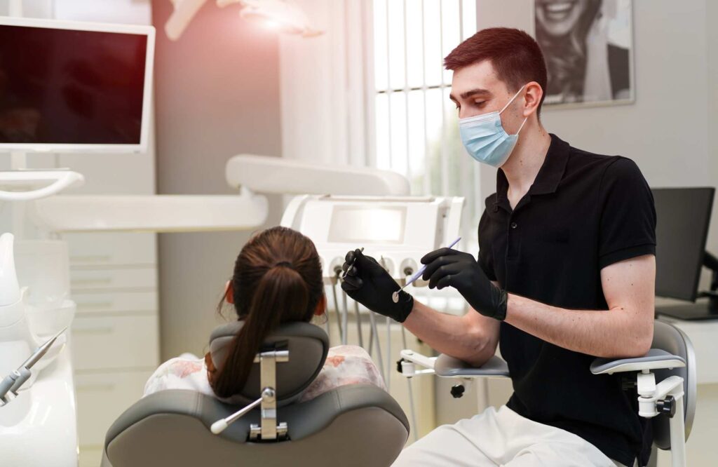 03 Dentist performing a dental procedure on a patient_Dental Implants Procedure, dental implants in Miami