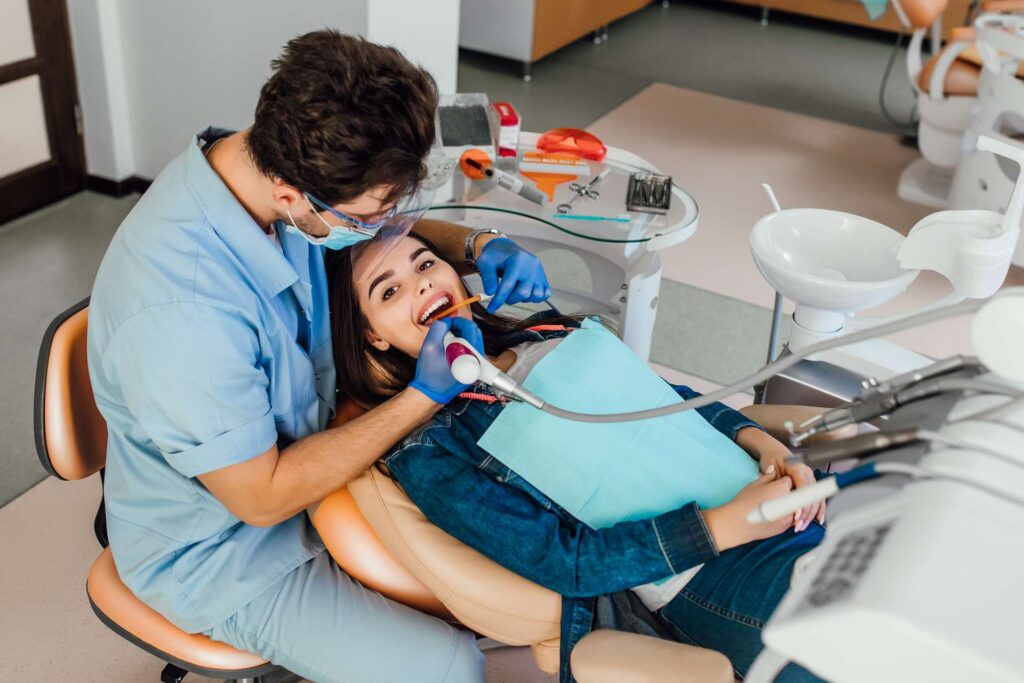 04 A patient receiving treatment at a dental clinic_Dental implants pros and cons, dental implants in Miami