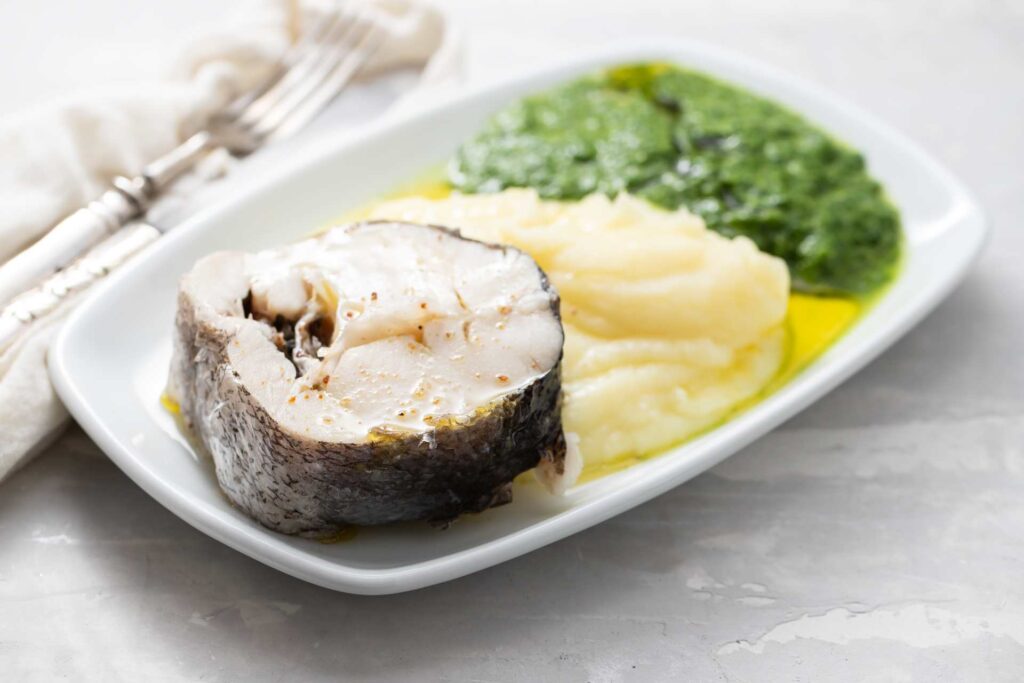 06 A rectangular plate of mashed potatoes with steamed fish and spinach_How soon after dental implants can I eat normally