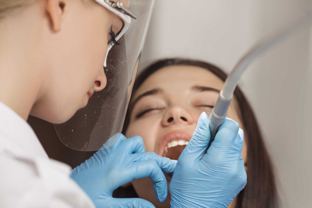 08 A dentist performing a treatment to a patient_Dental implants procedure, dental implants in Miami