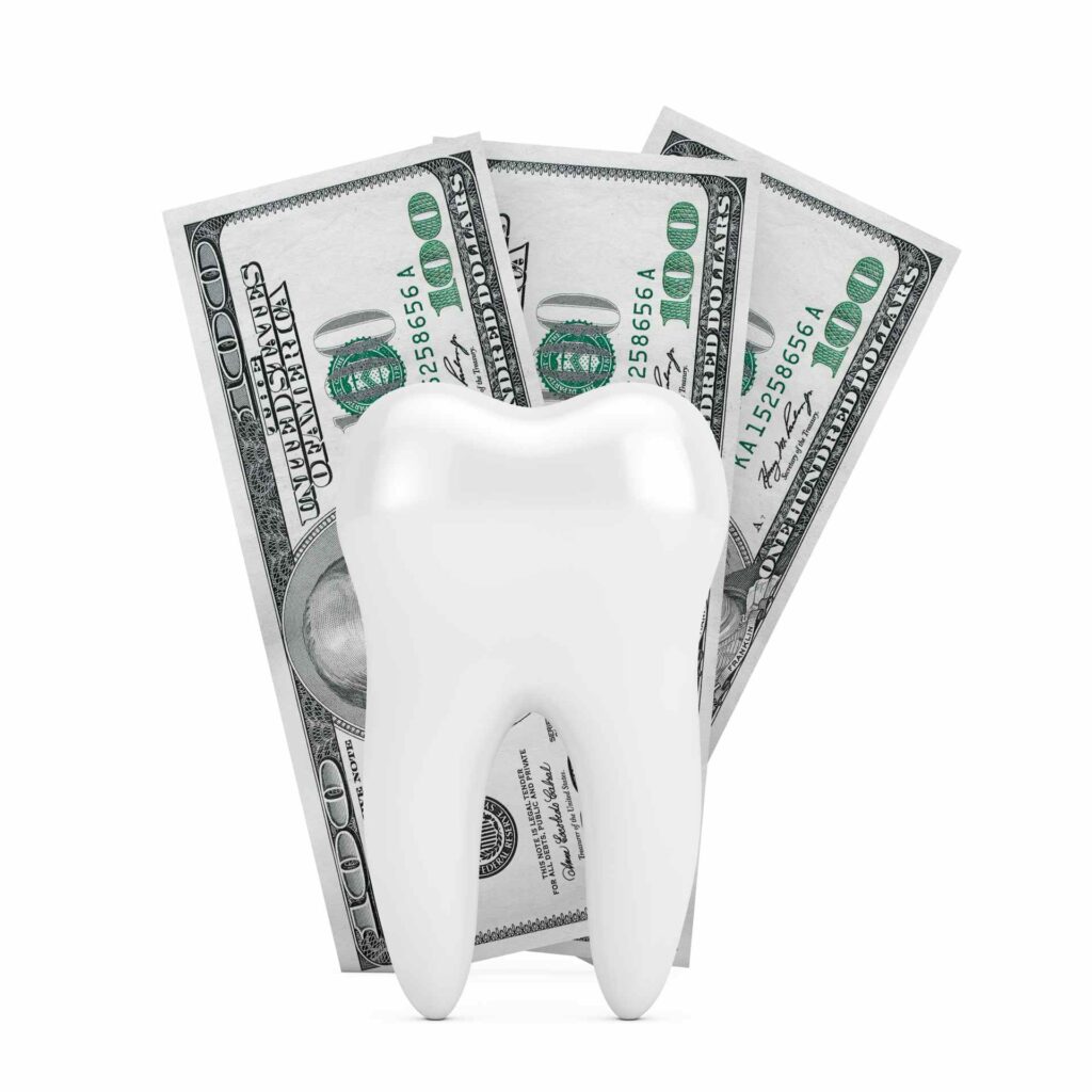 08 Dental insurance concept illustrated by a mock-up of a molar with $100 bills in the background_Dental insurance in the USA covering implants