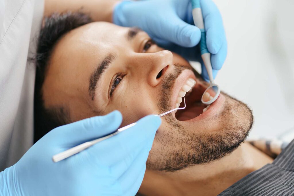 11 Patient receiving dental treatment in a dental clinic_Do dental implants hurt