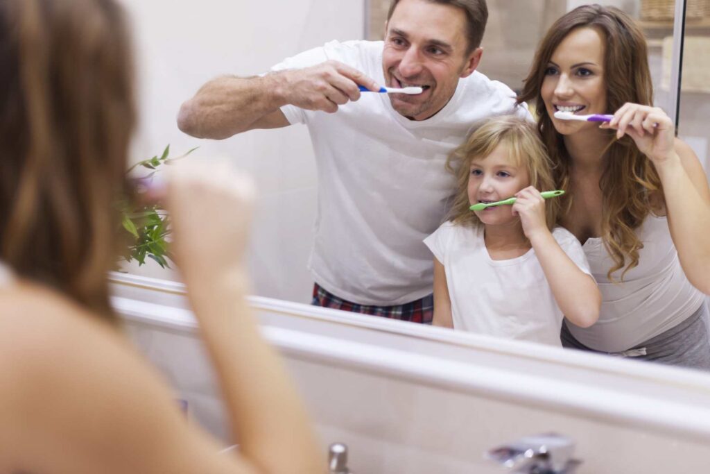12 Young parents educating their daughter on proper tooth brushing and oral hygiene_What is the risk of tooth decay