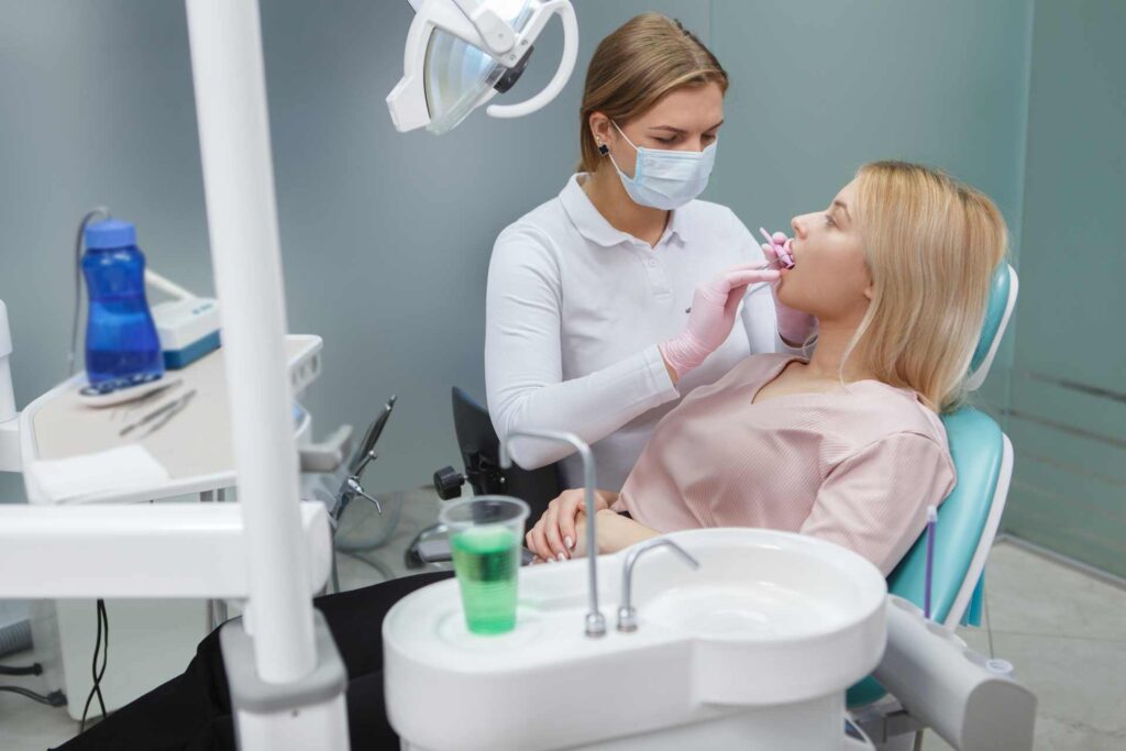 17 A patient receiving dental treatment in a dental clinic_Dental insurance in the U.S. covering implants