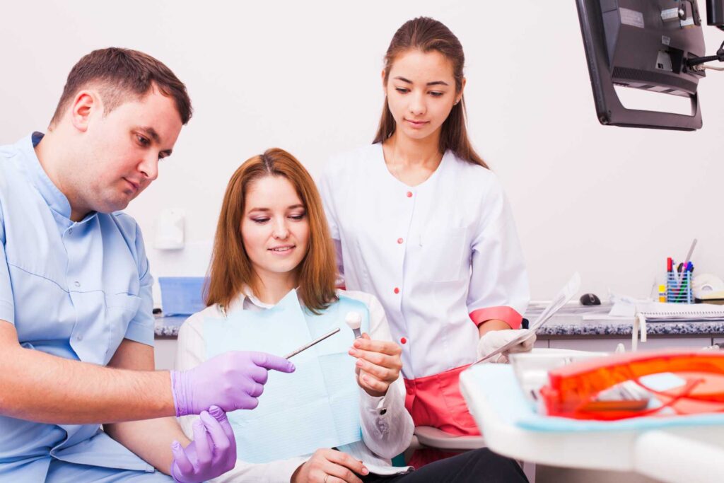 04 A patient receiving guidance from her dentist about dental implants