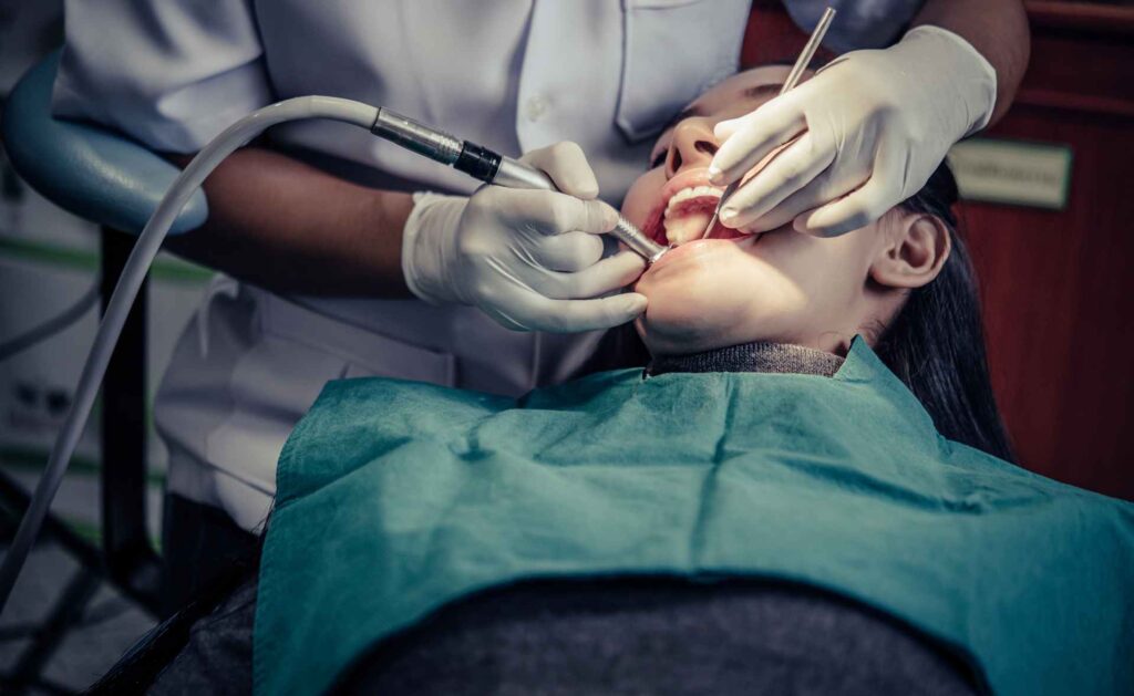 07 Patient receiving treatment in a dental clinic dental bridges vs dental implants