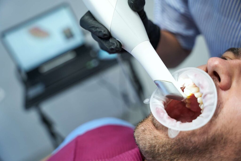 A patient receiving laser treatment at a dental clinic